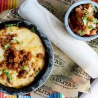 Queso Fundido  · Traditional melted cheese dip, flour or corn tortillas & pico de gallo. plain or chorizo