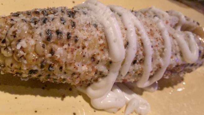 Elote · Mexican style corn on the cob, cotija cheese, chili & lime, crema