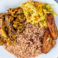 Curry Goat · Succulent pieces of goat meat season with curry powder , fresh herbs and spices.  served wit...