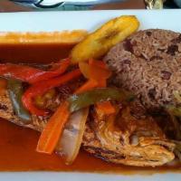  Brown Stewed Red Snapper · Marinated red snapper fried then stewed in a savory  fish sauce . Served with two sides.