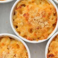 Macaroni & Cheese · Elbow macaroni baked with three cheese blend with spices and baked to perfection.
