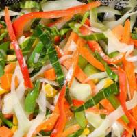 Steamed Vegetables (Mixed Vegetables) · Shredded cabbage and carrots are cooked with onion, garlic, bell pepper, and thyme.