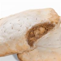Jerk Chicken Patty · Jerk Chicken Patties have a light yellow, flaky, pastry crust filled with chunks of diced ch...