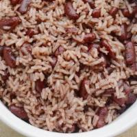 Rice & Peas · Jamaican Rice and Peas is infused with coconut,  herbs spices and cook until tender and deli...