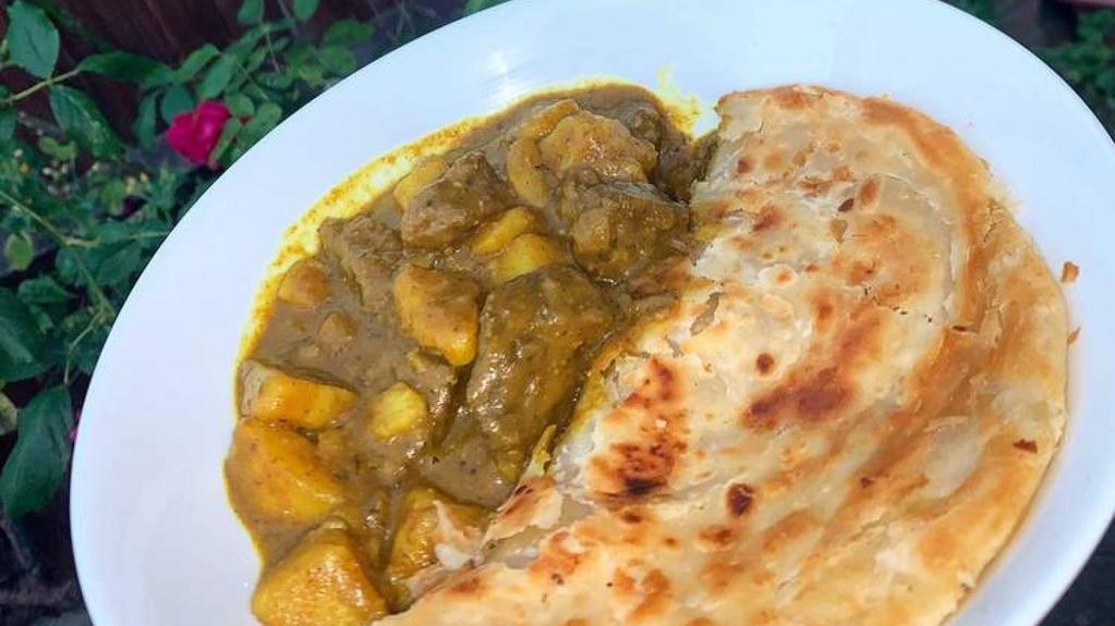 Goat Roti · Goat Roti is a type of wrap roti, filled With curried goat folded tightly within a roti or sold separately.