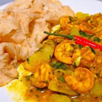 Curry Shrimp Roti · Curry shrimp Roti is a type of wrap roti, filled with curried shrimp folded tightly within a...