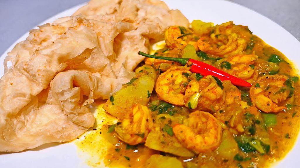 Curry Shrimp Roti · Curry shrimp Roti is a type of wrap roti, filled with curried shrimp folded tightly within a roti or separated .