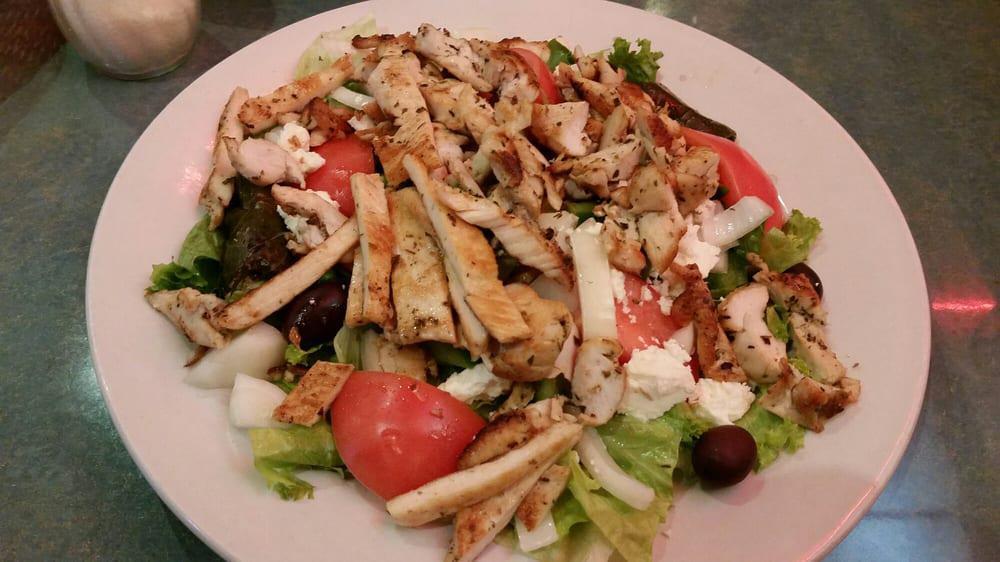 Greek Salad · Feta cheese, anchovies, mixed vegetables, olives, tomato, cucumbers and scallions.