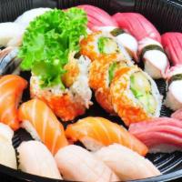 Tsukiji Sashimi Platter/极品四人盛 · Served with four pieces tuna, four pieces Toro, four pieces salmon, four pieces botan ebi, f...