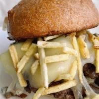 The Daddy · Black truffle butter, cheddar, blue cheese, caramelized onions, shoestring potatoes.