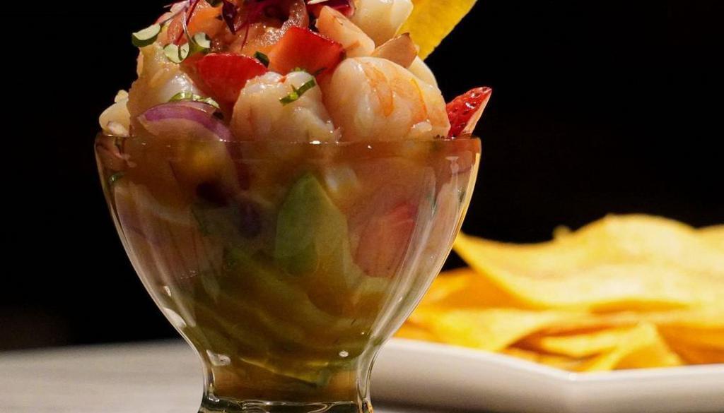 Ceviche Mixto · Shrimp, calamari, scallops,  marinated in citrus juices, cilantro, red onions, avocado