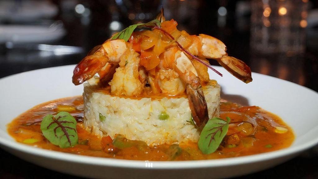 Camarones Enchilados · Braised shrimp in tomato, creole sauce, onions, peppers, thyme, served with white rice