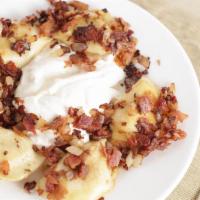 Pierogies · Made close to home, these dumplings are stuffed with potato and sauerkraut & sauteed in butt...