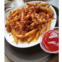 Ecstasy Fries · Fries topped with melted cheddar cheese and sprinkled with bites of bacon.