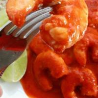 Camarones A La Diabla · Sauteed shrimps and onions in a VERY SPICY! hot red salsa. Accompanied with rice and beans. ...