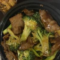 Beef With Broccoli  · Served with white rice.