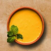 Flavored Mango Lassi · Traditional yogurt-based drink that has a blend of fresh yogurt, sweet diced fresh mangoes a...
