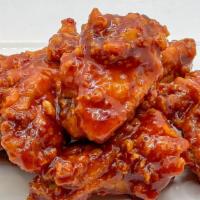 Korean Sweet Chili Wings · Double fried crispy chicken wings tossed in Korean style sweet & chili sauce.