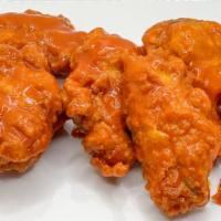 Buffalo Chicken Wings · Double fried crispy chicken wings tossed in Hot Buffalo sauce.
