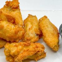 Fried Chicken Wings · Double fried crispy chicken wings with choice of dipping sauce.