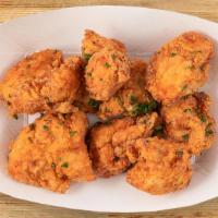 Small Crunchy Poppers (8 Pc) · 8 chicken poppers  with your choice of one sauce.