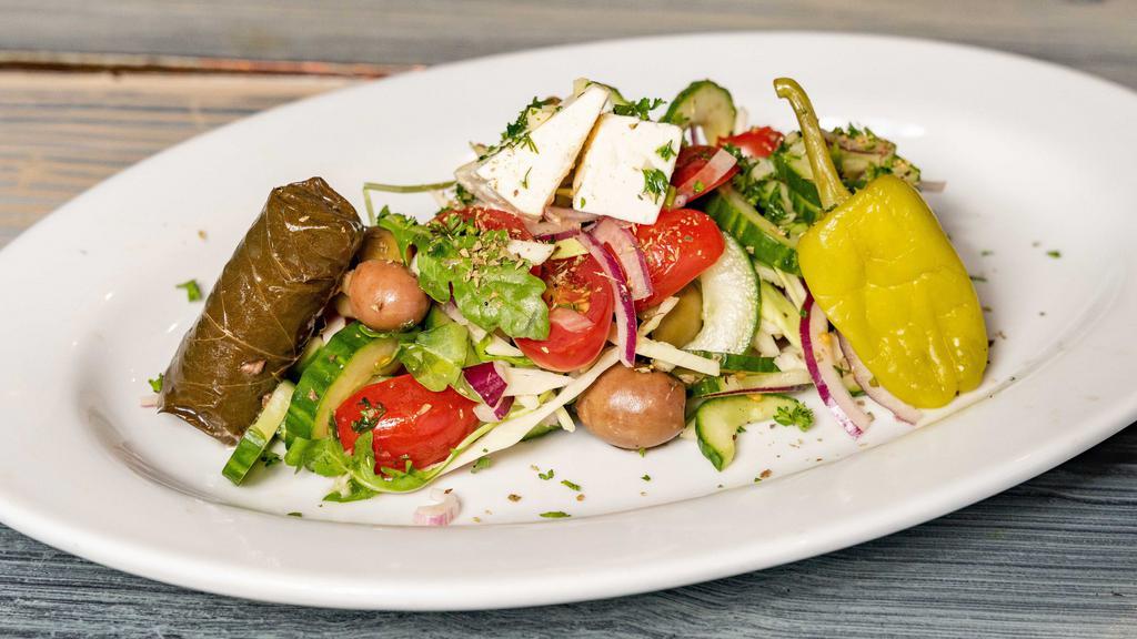 Greek-Ish Salad · Tomato, cucumber, red onion, olive, pepperoncini, feta.