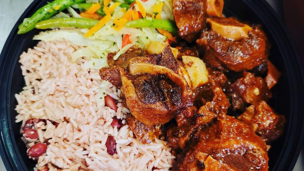 Oxtail Stew(One Size) · Oxtail seasoned to the bone with an array of natural island spices. Deliciously served with choice of 2 sided.