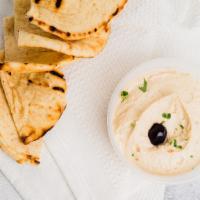 Hummus · Mashed chickpeas mixed with tahini, lemon juice, extra virgin olive oil, and garlic. Has Dai...
