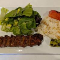 Lamb Adana Kebab · Chopped lamb mixed with fresh herbs and spices cooked on flat shish.