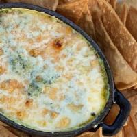 Spinach & Artichoke Blue Cheese Dip · Served with crispy chips.