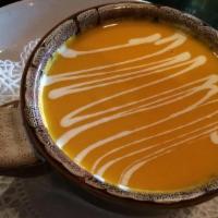 Carrot & Ginger Soup · Drizzled with crème traîche.