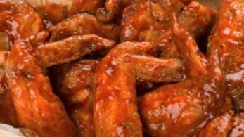 Buffalo Wings · Eight pieces. Served with celery sticks and bleu cheese.