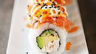 Volcano Roll · Whitefish, masago, and scallion deep fried, sliced with the spicy tuna on top.