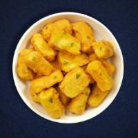 Dear Paneer Pakora · Marinated cubes of cottage cheese, bell peppers, onions & tomatoes  in a light batter and fr...