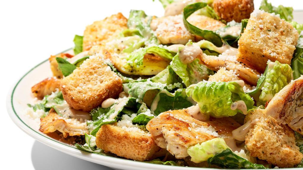 Chicken Caesar Salad · Grilled chicken or crispy chicken. Comes with Romaine Lettuce, Parmesan Cheese & Croutons.