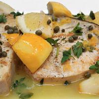Swordfish Piccata Style · Swordfish steak with capers in a lemon and butter sauce, served with mashed potatoes and str...