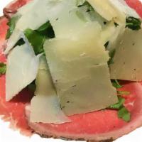 Carpaccio Di Manzo · Grass-fed thin-sliced beef, baby arugula and 36-month-old Parmigiano cheese.
