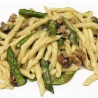 Fusilli Con Gorgonzola, Asparagi E Noci · Fresh fusilli pasta with asparagus and walnuts in Gorgonzola sauce.