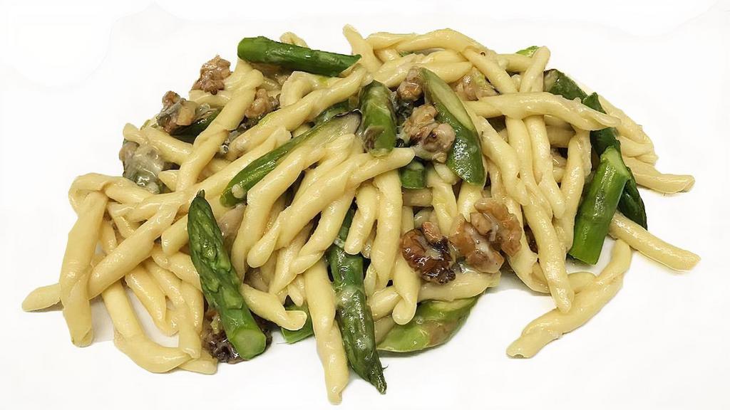 Fusilli Con Gorgonzola, Asparagi E Noci · Fresh fusilli pasta with asparagus and walnuts in Gorgonzola sauce.