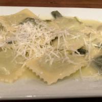 Ravioli Di Ricotta Con Burro E Salvia · Homemade spinach and ricotta cheese ravioli with brown butter and sage.
