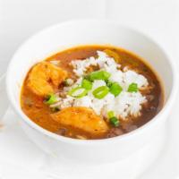 Seafood Gumbo Cup · Shrimp, crabmeat, andouille sausage, and okra in a savory brown gumbo stock, served with rice.