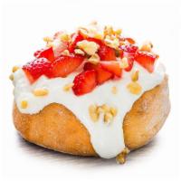Strawberries & Cream Roll* · cream cheese frosting topped with fresh strawberries and walnuts