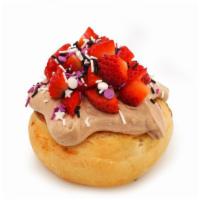 Sparkle Berry Roll* · chocolate frosting topped with sprinkles and fresh strawberries (sprinkle colors may vary)