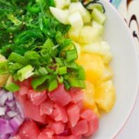 Tuna Special · Tuna, scallion, seaweed salad, onion, cucumber, pineapple, ginger, and wasabi aioli.