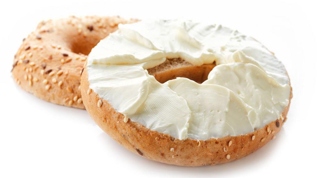 Bagel With Cream Cheese · Fresh baked bagel with a side of cream cheese.