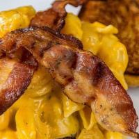 Macaroni And Cheese Burger · Our burger topped with American cheese, homemade macaroni and cheese, and bacon. 1/4 lb beef...
