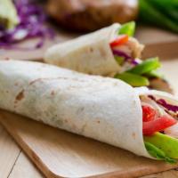 California Turkey Wrap · Delicious Wrap made with Sliced grilled turkey, avocado, plum tomato, romaine lettuce and ci...
