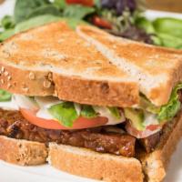 Grilled Tempeh Sandwich 烧鸡三明治 · Tempeh, tomato, avocado, lettuce, caramelized onions with mayo and almond tahini sauce (Glut...