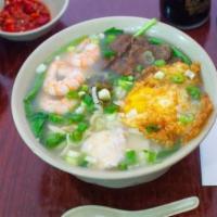 #2 House Special Noodle Soup · Chicken, shrimp, beef, and a fried egg. Hand pulled noodles, knife peeled noodles, rice nood...