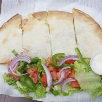 Chicken Quesadilla · Grilled chicken, mozzarella cheese, sauteed onions and green peppers.
